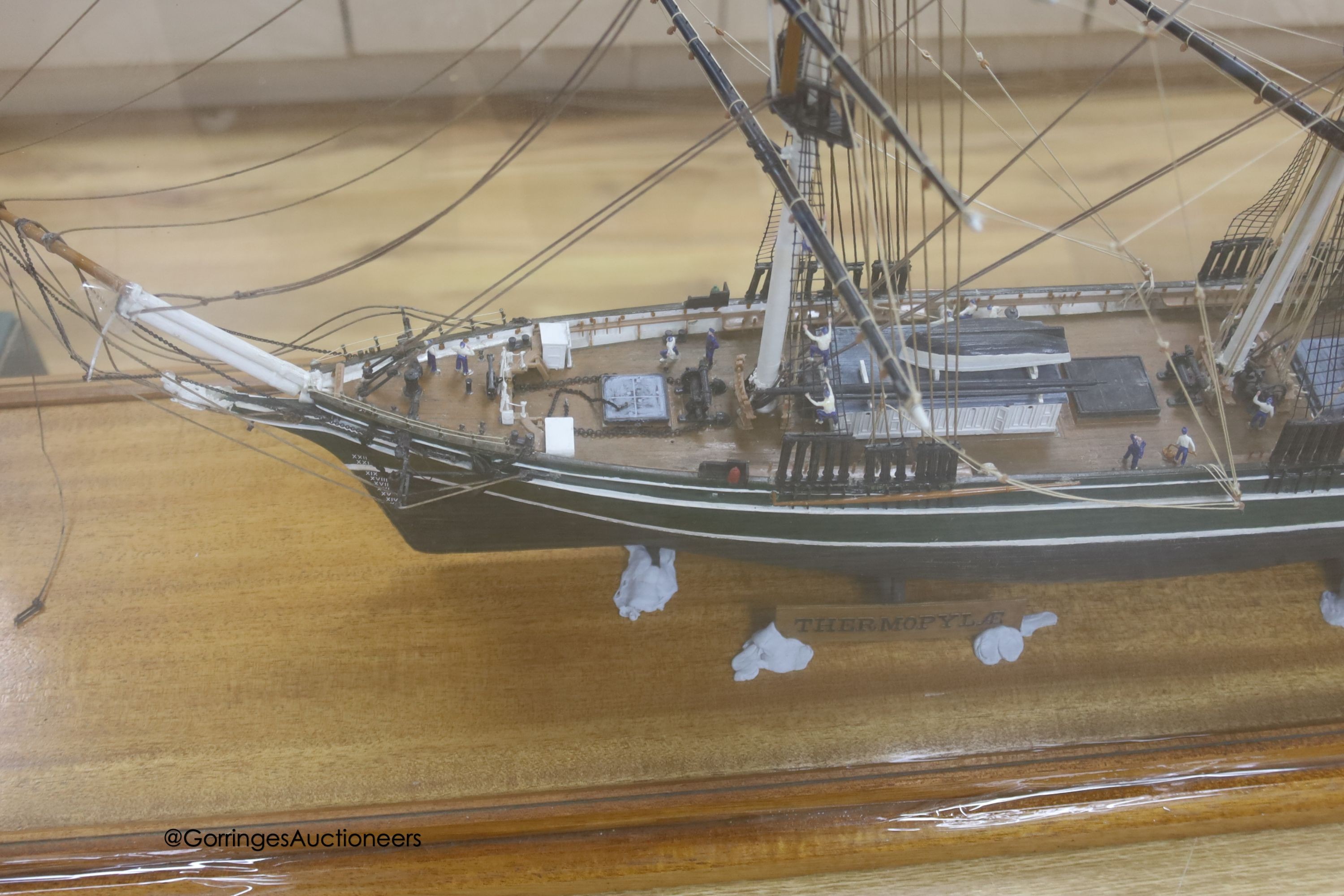 A model of a clipper ship in glazed case